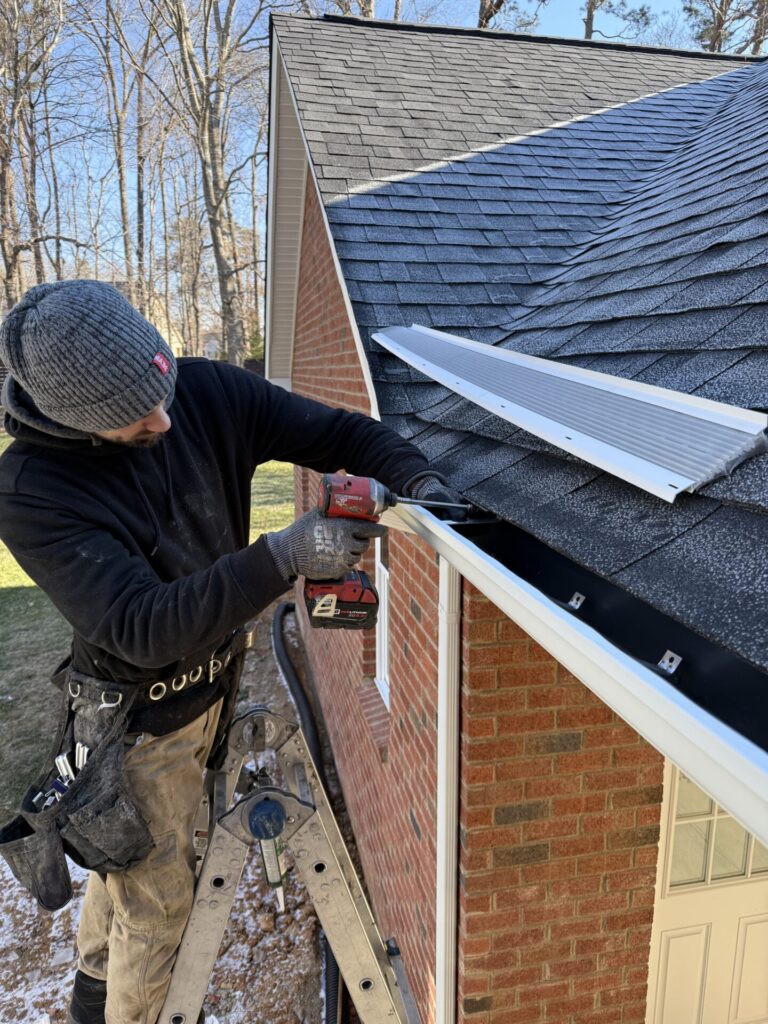 LeafFilter contractor installing new LeafFilter gutter guards on a residential gutter system