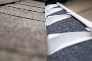 foam gutter guards in gutter section installed on shingle roofline