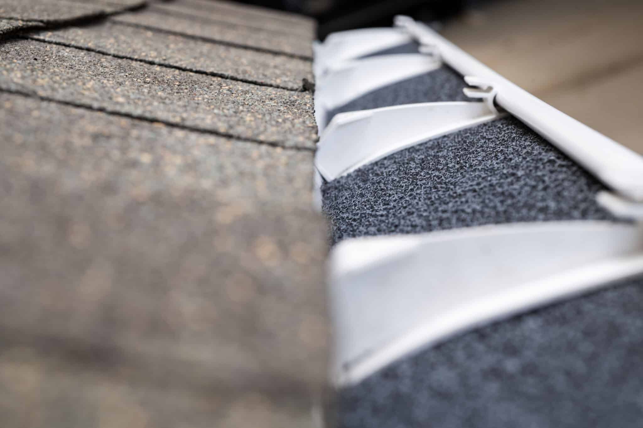 foam gutter guards in gutter section installed on shingle roofline