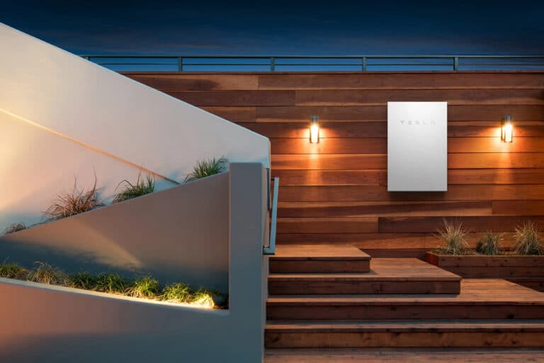 Tesla Powerwall solar battery on a home wall.