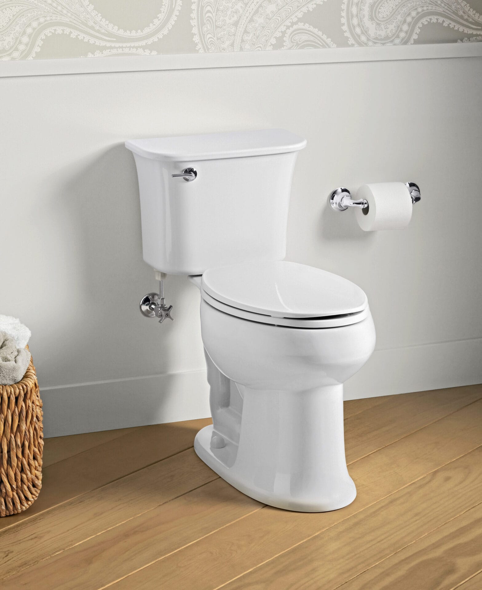 A two-piece toilet and toilet paper holder.